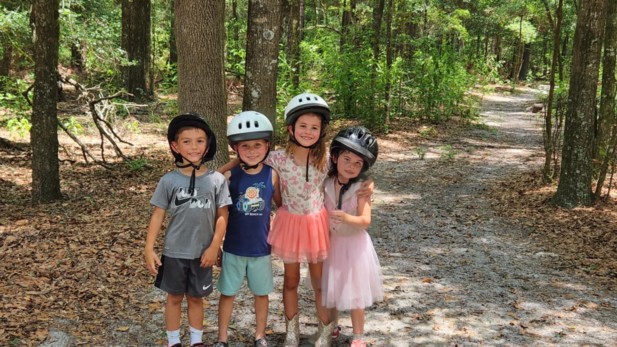 Kids posing in the woods