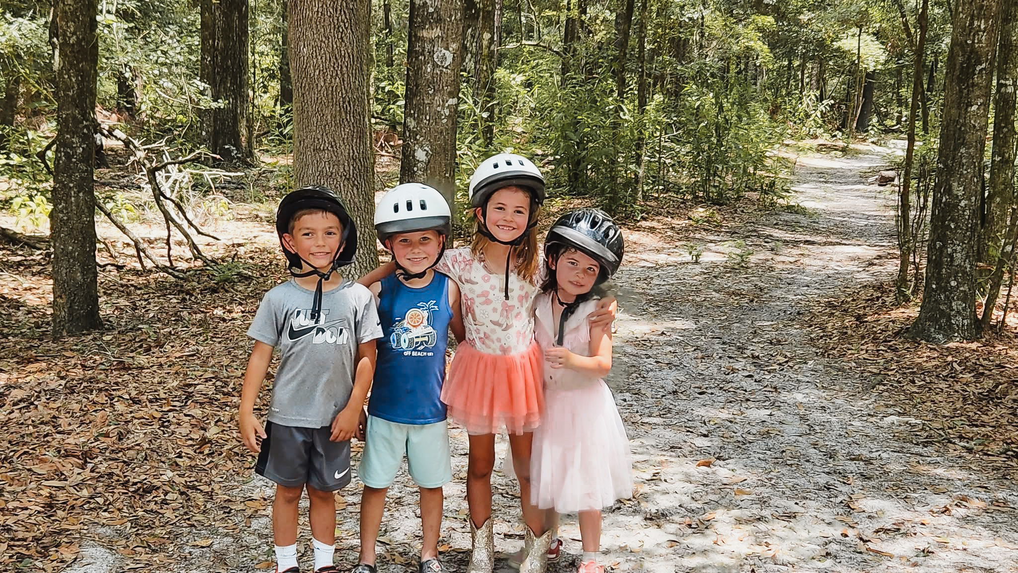 Kids smiling in the woods